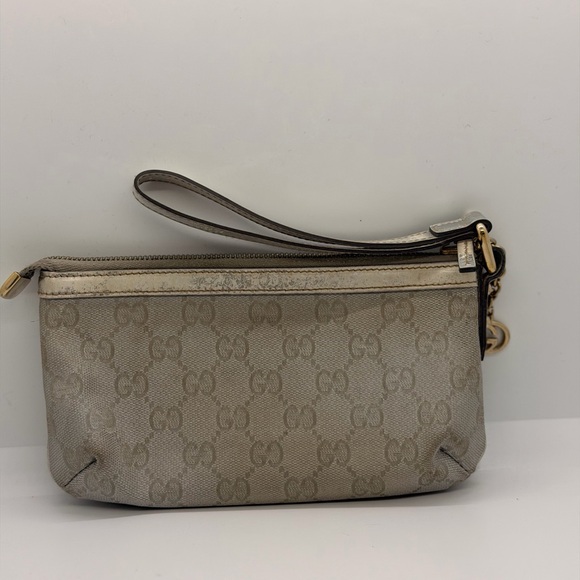 Gucci Handbags - Gucci Silver Monogram Wristlet Porchette